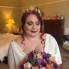 Purple haired alternative bride with purple and silver eyeshadow, dark lipstick and celestial theme