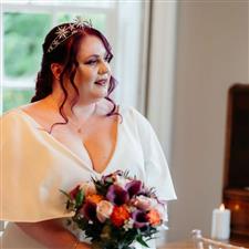 Alternative bride with purple hair and bouquet wears celestial themed silver tiara