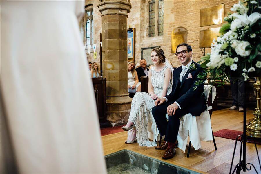 Happy couple in Nottingham church on their wedding day