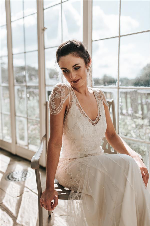 Bride sat down in white elegant wedding dress