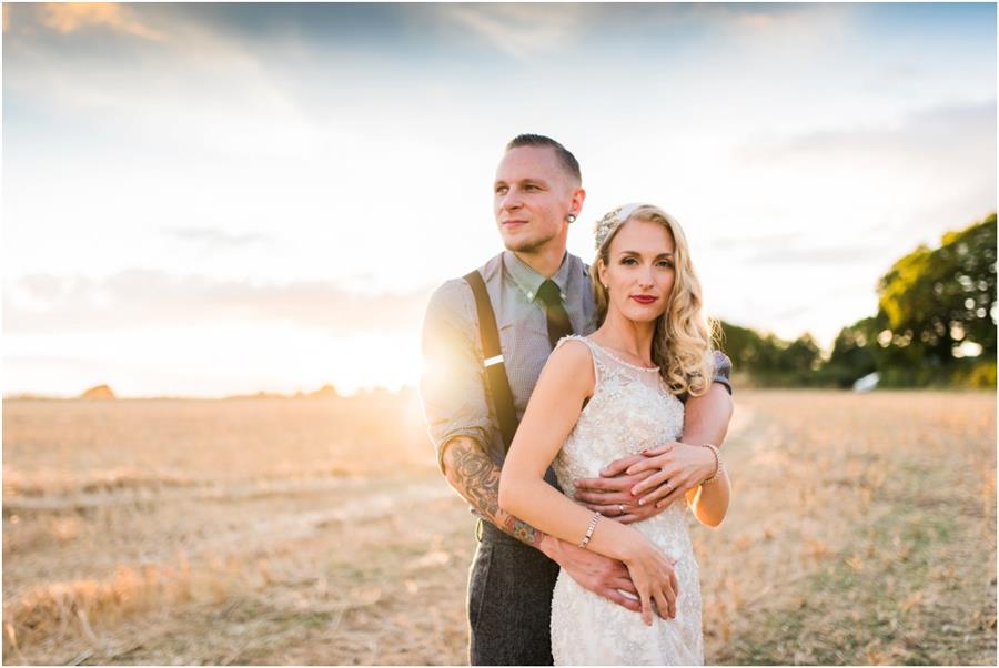 Couple embrace at sunset in golden light