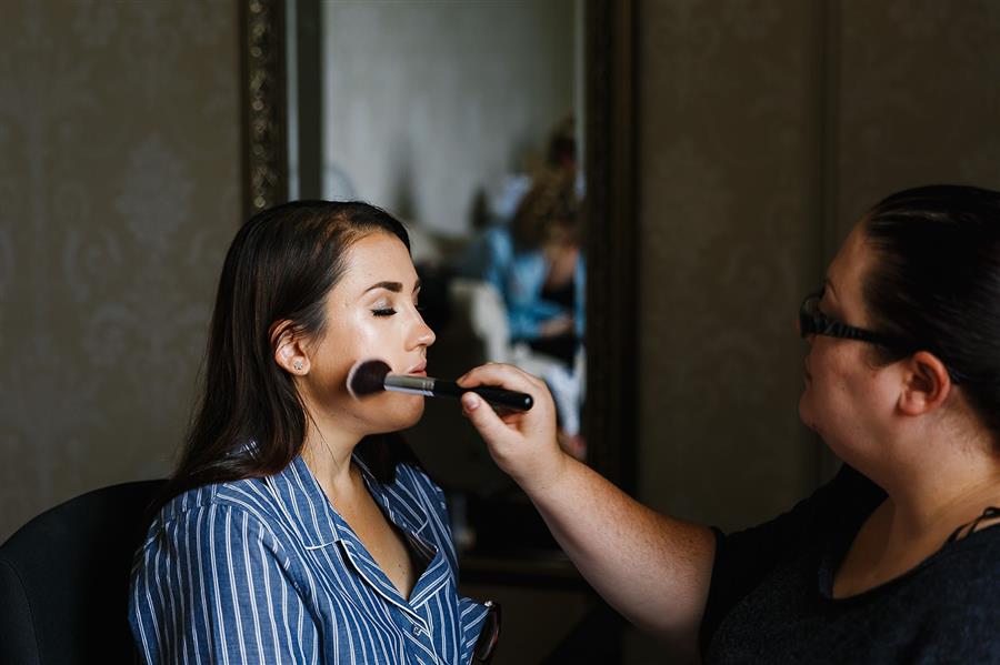 Emily and Katy Photography photograph Ms Moo Make Up applying wedding makeup