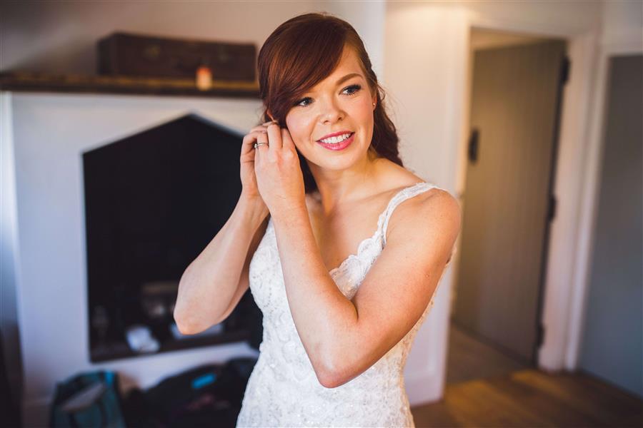 Smiling bride to be in white dress by Matt Brown Photography
