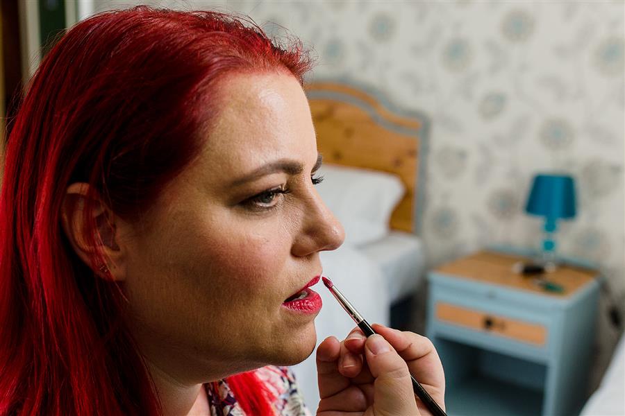 Ms Moo applying Illamasqua lipstick to a bride to be