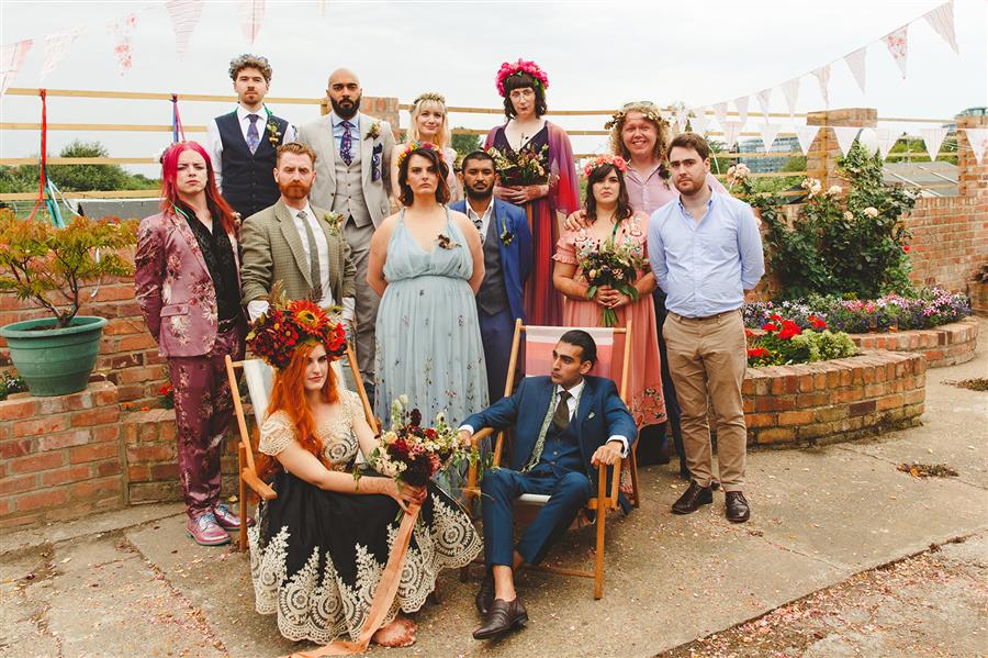 Colourful group shot for alternative wedding by Camera Hannah