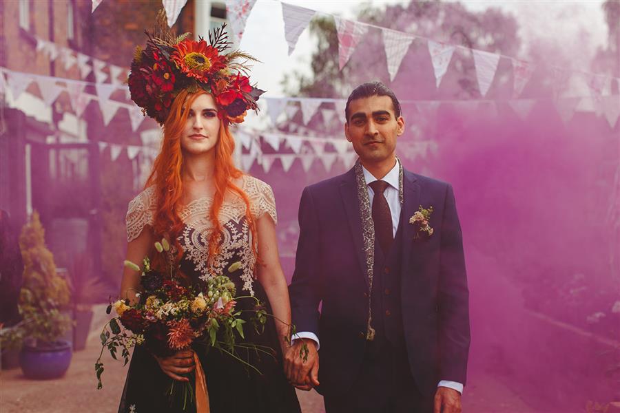 Pink smoke bomb and wedding couple by Camera Hannah