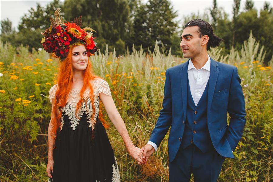 Bride and groom in field and nature